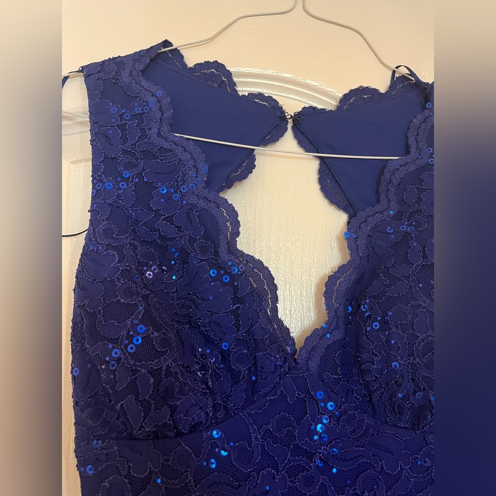 Floor length navy blue lace gown.